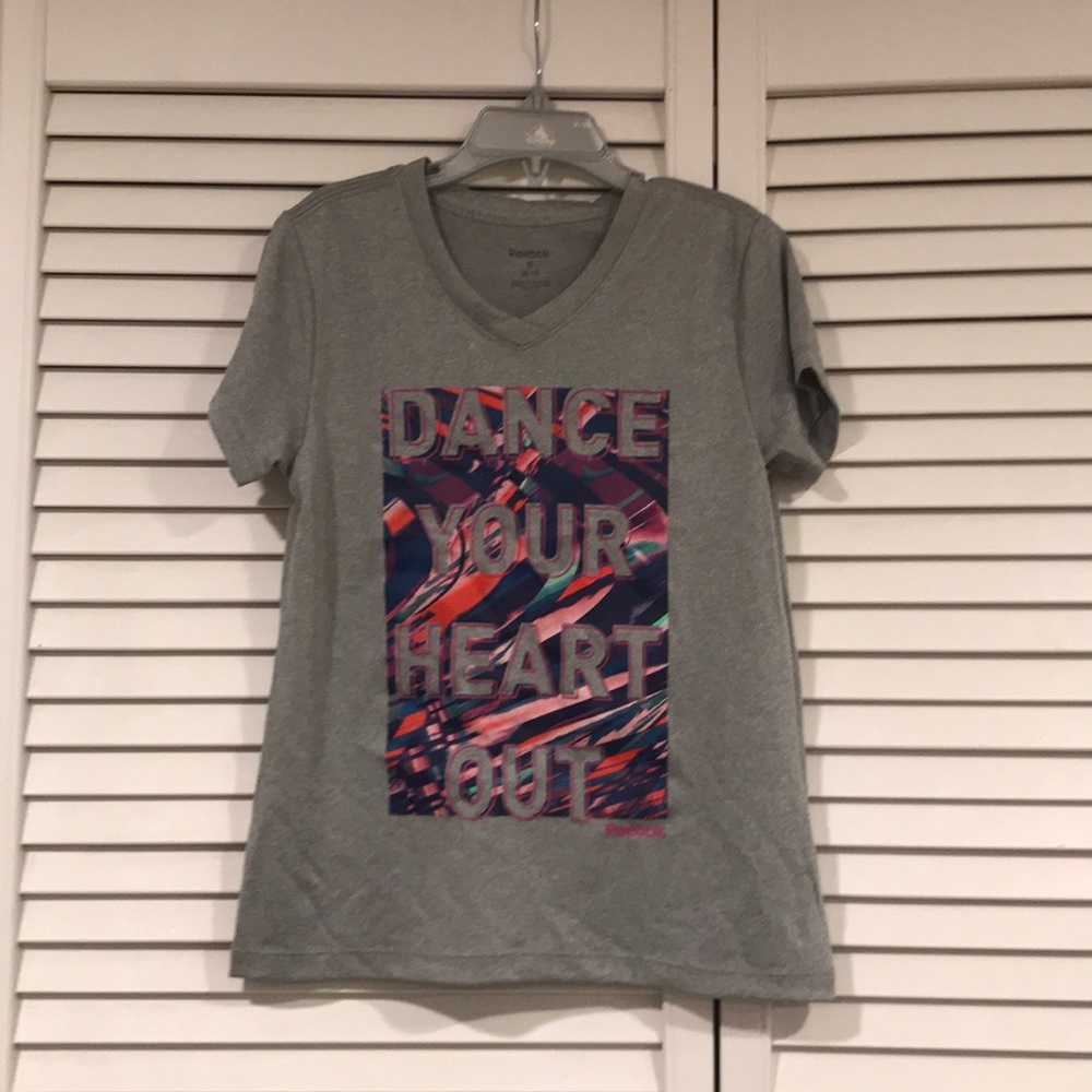 New w/o Tags.   Reebok girls Dance shirt size 8